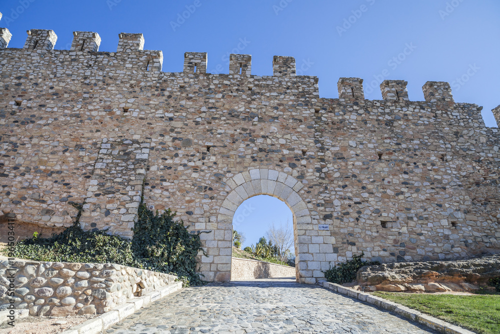 City walls, stone gate arch, medieval city of Montblanc, province Tarragona, Catalonia, Spain.