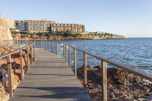 Wooden boardwalk close to sea in mediterranen town of Salou, Costa Daurada, province Tarragona,Catalonia.Spain.