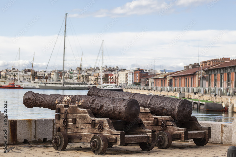Two old cannons in port of Tarragona, Catalonia, Spain. Two old cannons in port of Tarragona, Catalonia, Spain.