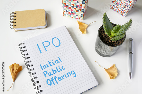 IPO Initial Public Offering written in notebook on white table
