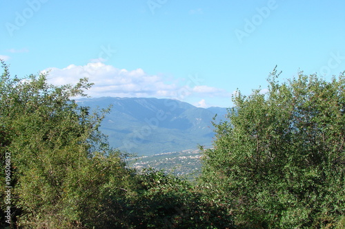 a view of the Crimean mountain range and an inhabited valley at its foot. © Hennadii