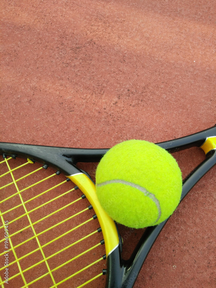 Tennis Ball with Racket on the tennis court