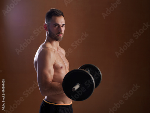 Young man training with weight lifting. © Julián Maldonado
