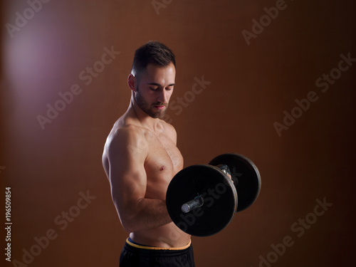 Young man training with weight lifting. © Julián Maldonado
