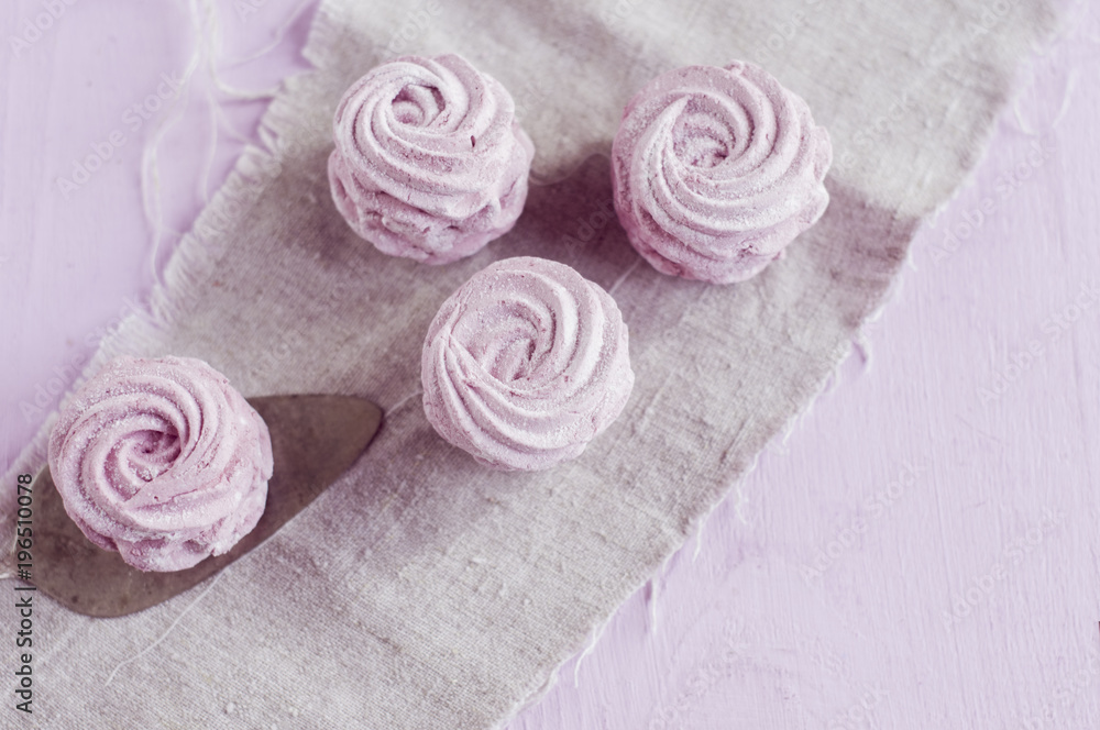 flat lay berry marshmallow on a gray napkin with free space for text. flat lay berry marshmallow on a gray napkin with free space for text.