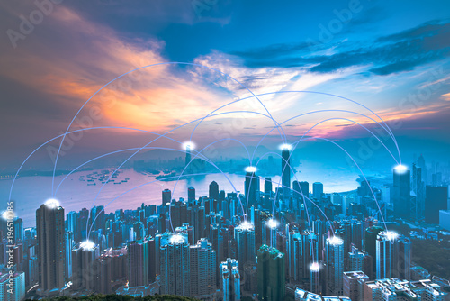 Modern cityscape and linking communication network in violet tone, communication concept.