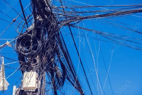 Messy electric wiring on the pole