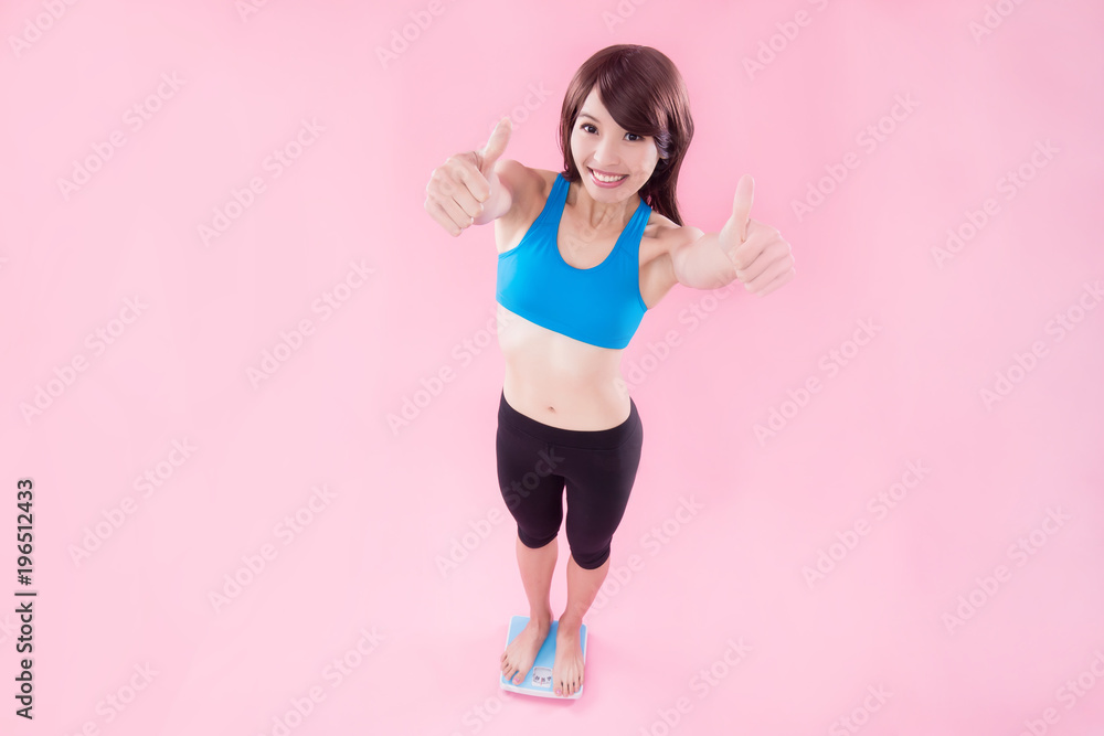 woman stand on weight scale woman stand on weight scale