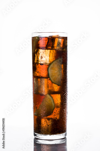 Cuba libre. Cocktail with rum, lime and ice on white background

