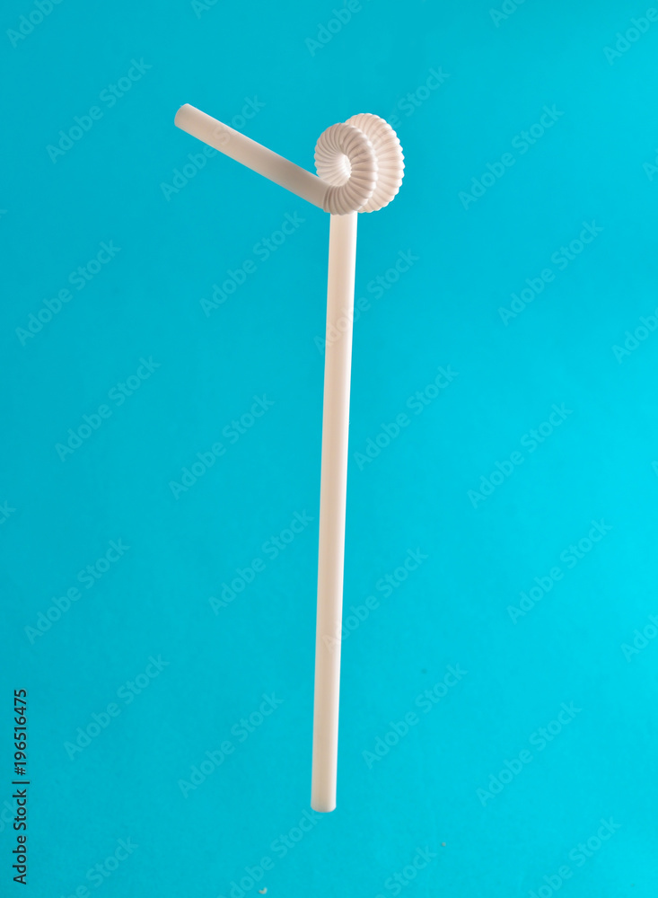 White cocktail tube on a blue background. White cocktail tube on a blue background.