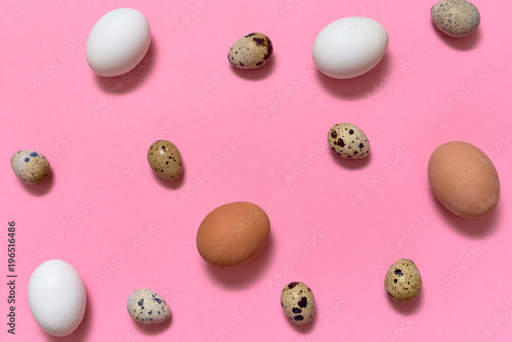 Hen white and brown eggs and quail eggs on pink background, copy space. Healthy food concept. Top view, flat lay. Easter eggs. Happy Easter concept Hen white and brown eggs and quail eggs on pink background, copy space. Healthy food concept. Top view, flat lay. Easter eggs. Happy Easter concept
