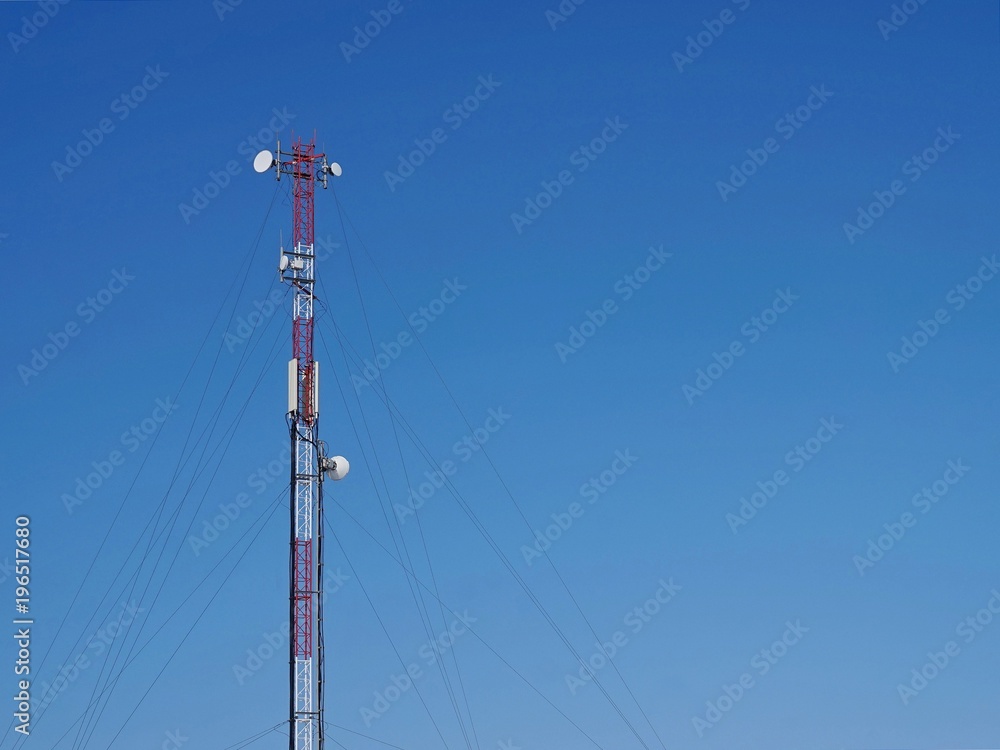 An object. Antenna of radio communication and mobile communication against the blue sky. An object. Antenna of radio communication and mobile communication against the blue sky.