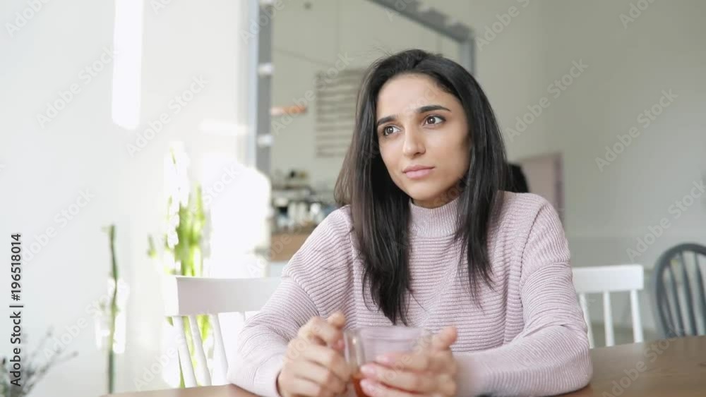 Beautiful woman drinking tea in a cafe Beautiful woman drinking tea in a cafe