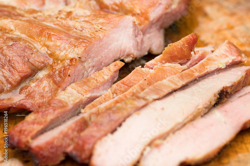 Close up tasty slice grilled pork on wooden board