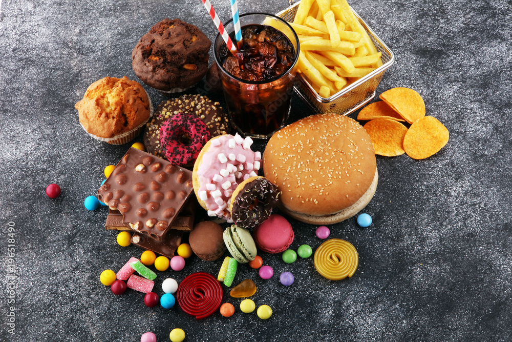 Fototapeta premium Unhealthy products. food bad for figure, skin, heart and teeth.