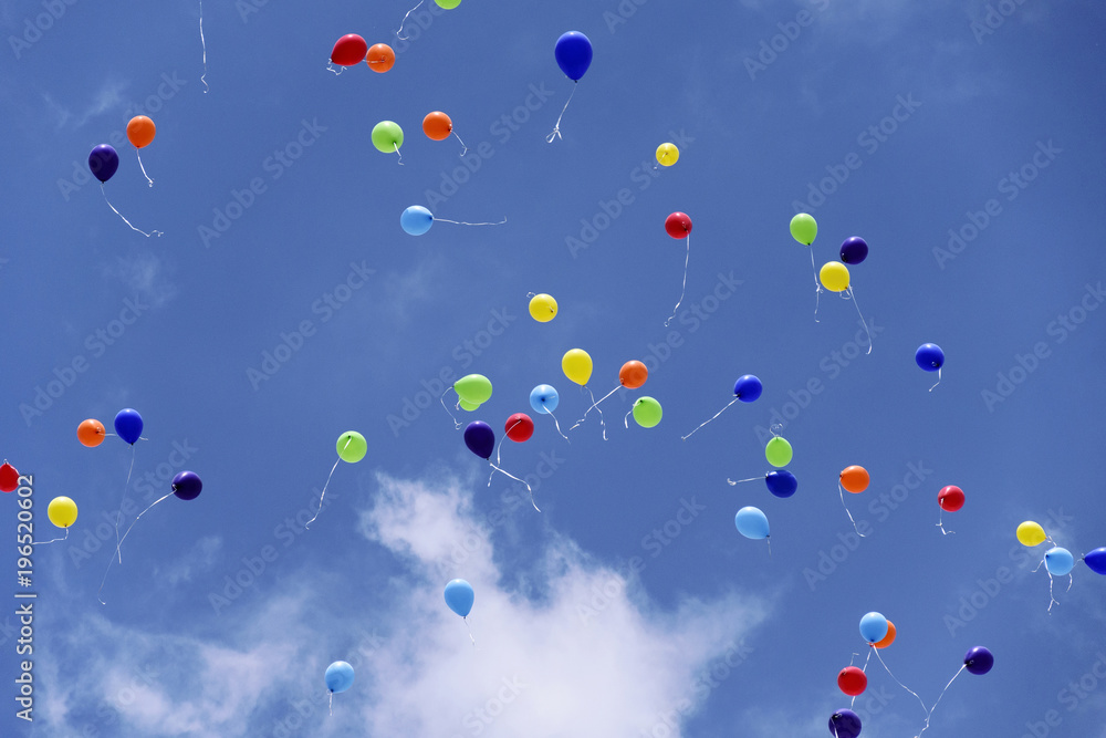 Fototapeta premium Balloons flying on background of the blue sky