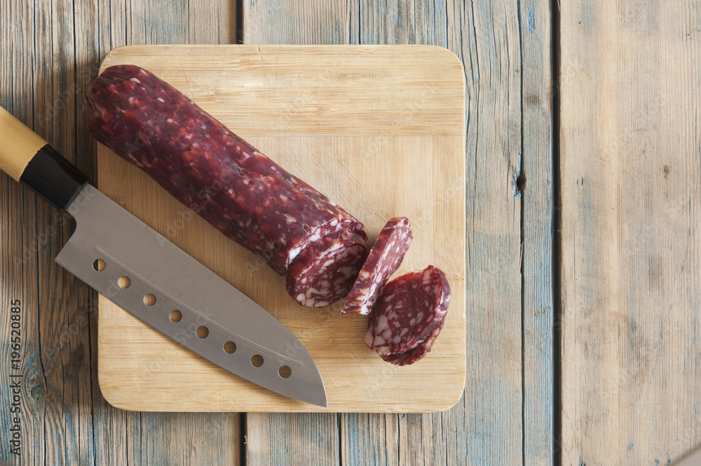 sausage on wooden aged background. sausage on wooden aged background.