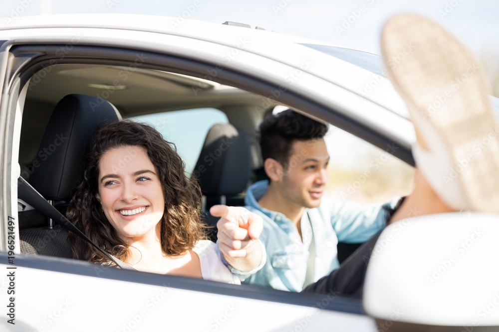 Young couple driving around and having fun
