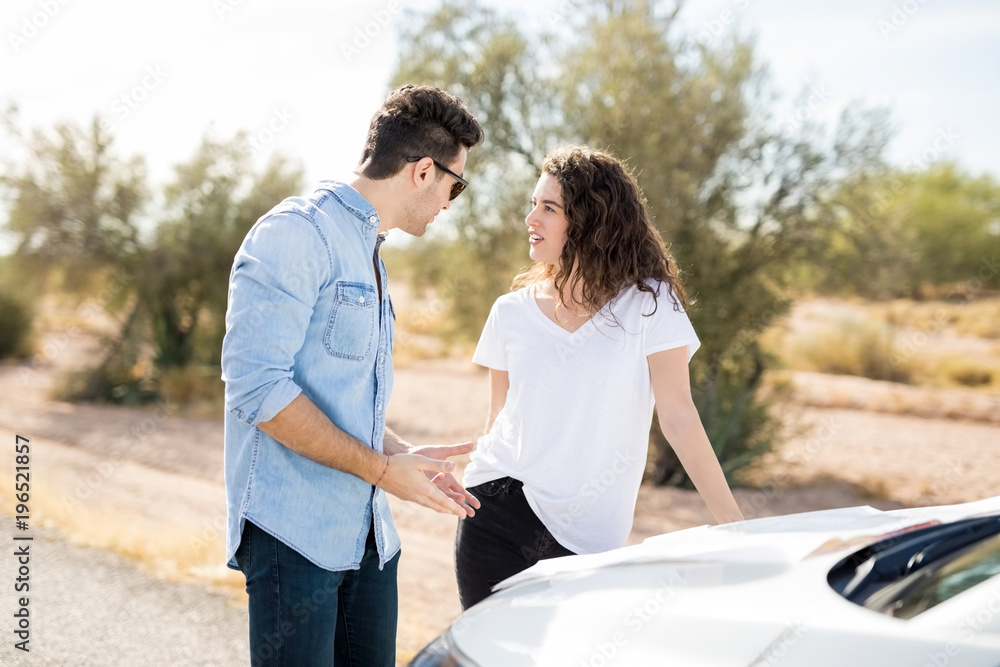 Couple argue on road trip with directions Couple argue on road trip with directions