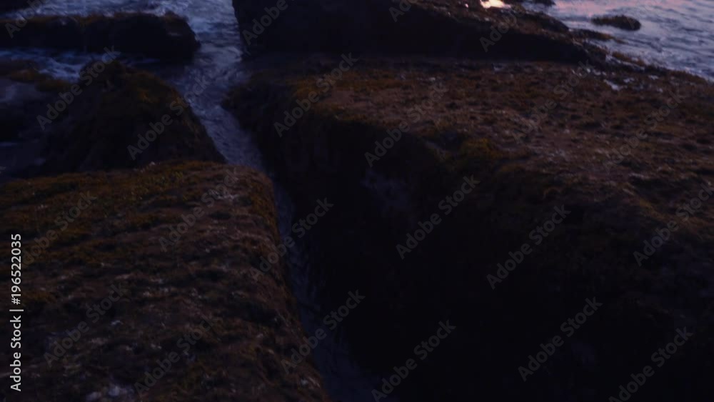 Amazing view sunset on the ocean beach on Bali island, waves, sky, rocks, video 4K with camera stabilizer, wonderful colors Amazing view sunset on the ocean beach on Bali island, waves, sky, rocks, video 4K with camera stabilizer, wonderful colors