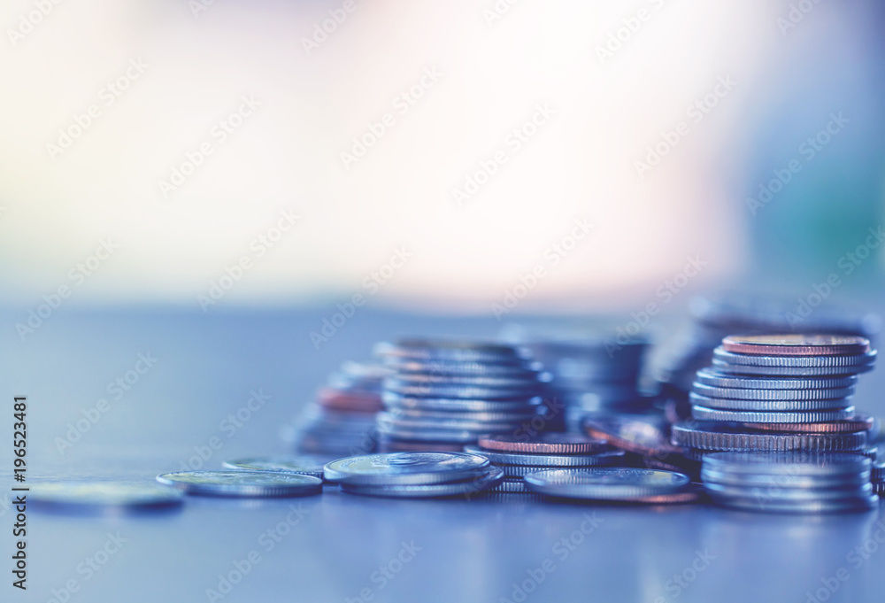 Row of coins on wood background for finance and Saving concept,Investment, Economy, Soft focus and dark style. Row of coins on wood background for finance and Saving concept,Investment, Economy, Soft focus and dark style.