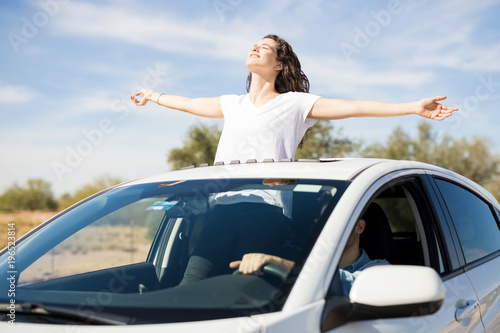 Woman having fun on road trip with boyfriend