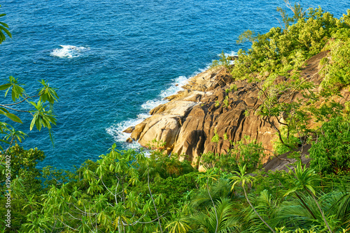 Anse major trail and view on granitic rocks, hiking on nature trail of Mahe, Seychelles photo