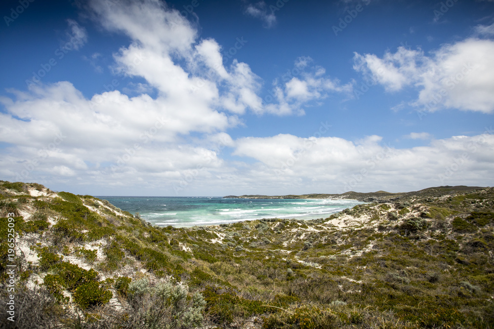 Clouds blow across the coastline of Rottnest Island, near Perth in Western Australia on a perfect sunny summer day.