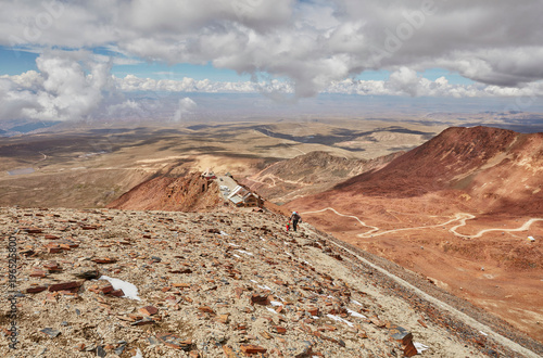 Mother and son, trekking across landscape, Chacaltaya, La Paz, Bolivia, South America