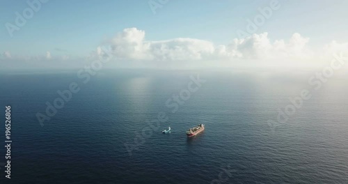 Aerial view of an offshore oil installation and supply ship