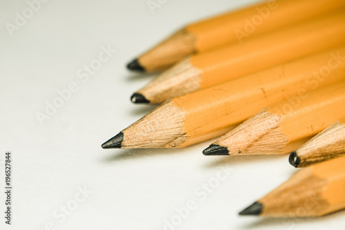 Pencils Laid Out on White Paper