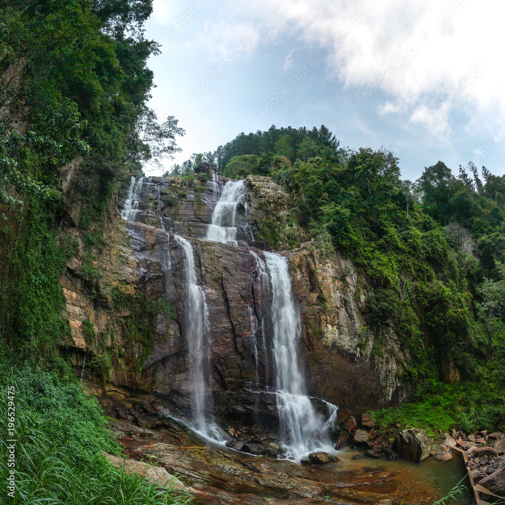 Fototapeta premium Fisheye wide shot of Ramboda Fall waterfall, Pussellawa Sri Lanka