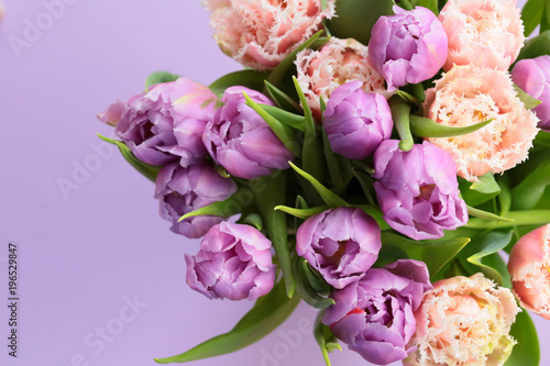 Purple Tulip Bouquet. lilac tulips on a gently purple background. bouquet of lilac and pink terry tulips flowers on a lilac background