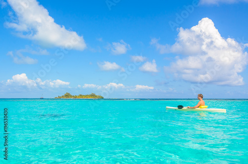 Kayaking in tropical paradise - Canoe floating on transparent turquoise water, caribbean sea, Belize, Cayes islands