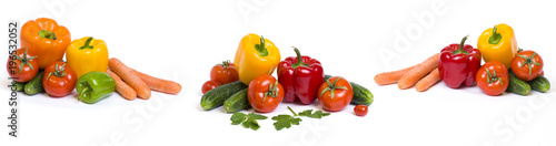 Red yellow and orange peppers with tomatoes on a white background. Cucumbers with colorful peppers in composition on a white background. Panoramic photo with vegetables on a white background..