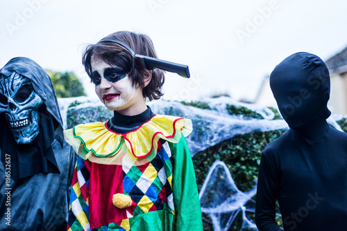 Young boys dressed in halloween costume, outdoors photo