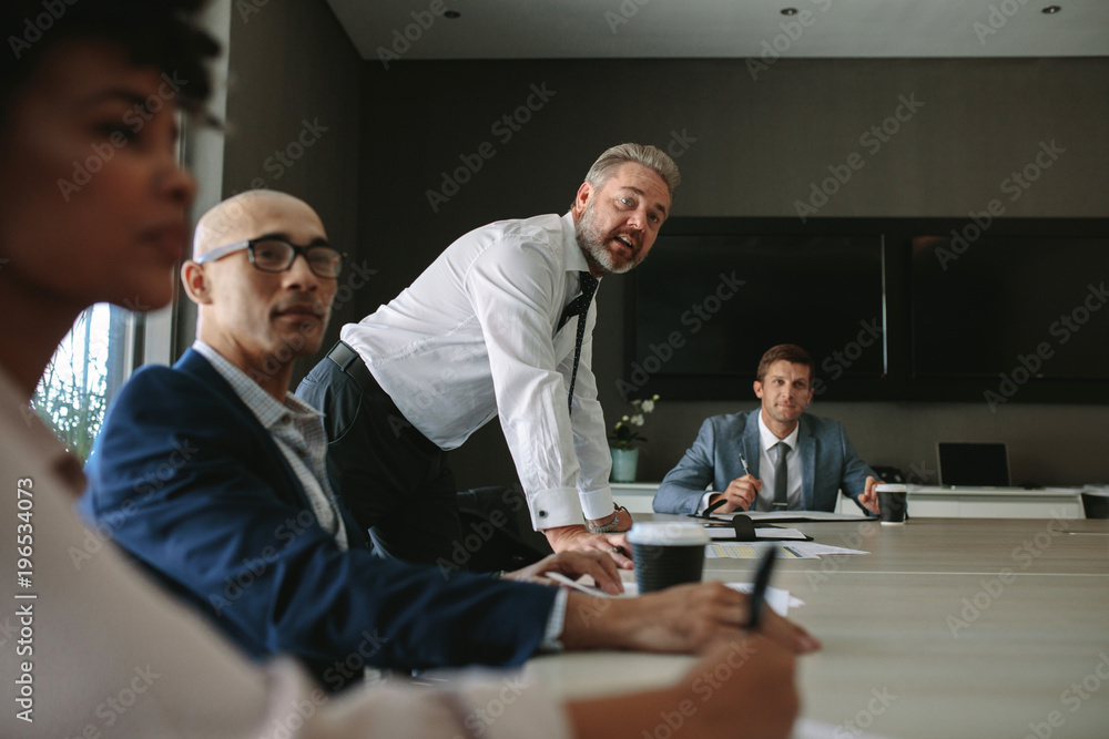 Business group having discussion at office meeting Business group having discussion at office meeting