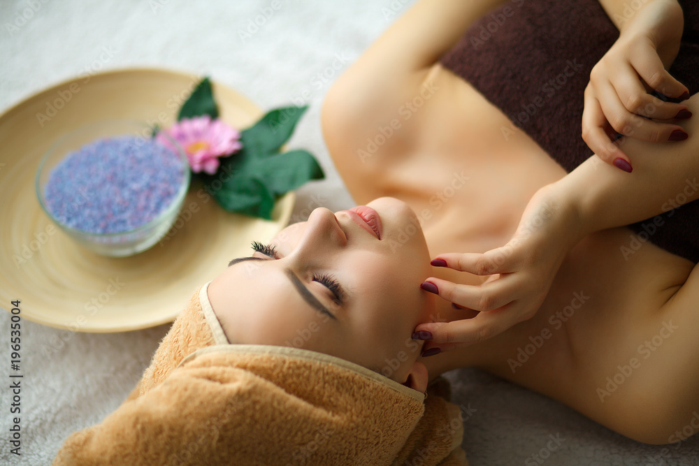 Spa. Young woman on massage table in beauty spa salon Spa. Young woman on massage table in beauty spa salon