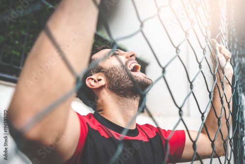 Soccer Fan Watching a Match at Stadium photo