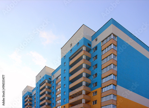 residential new building against the background of the sky blue, view from below