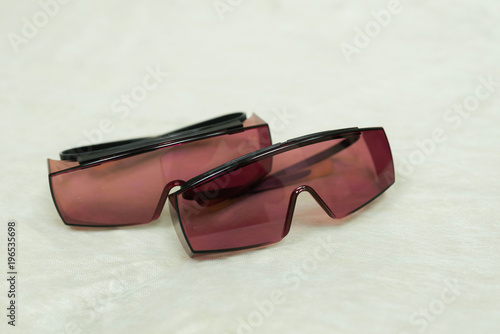 two pairs ofsafety glasses for laser hair removal