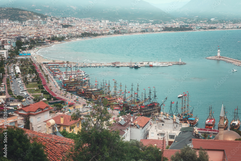 Alanya, Turkey. View on old city, bay, ships, beach and Mediterranean Sea