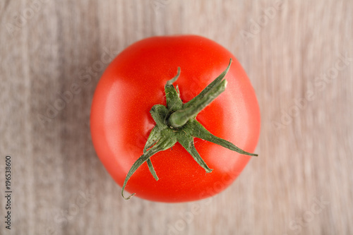 One fresh red tomato