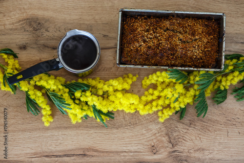 Coffee with homemade cakes and flowers flat lay photo