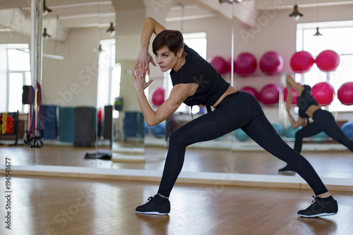 a woman at the gym doing exercises