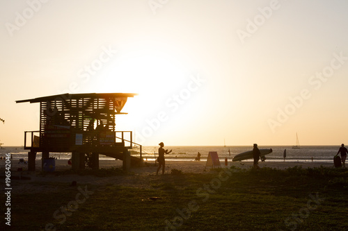 Lifeguard station at surfing beach sunset