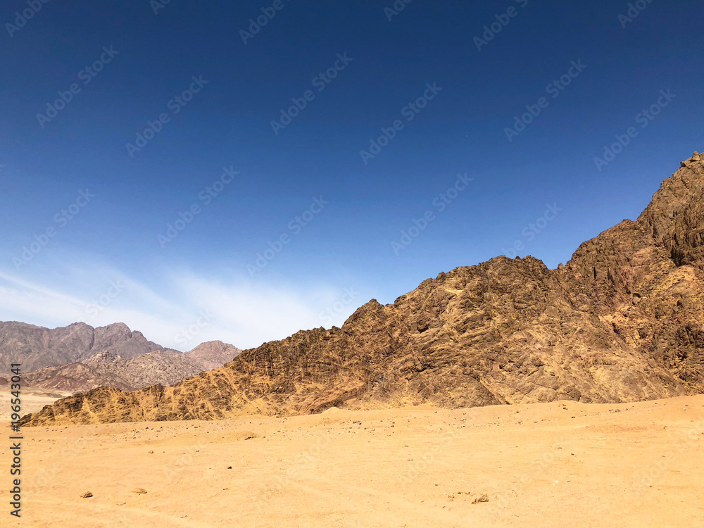 desert in with blue sky and mountains