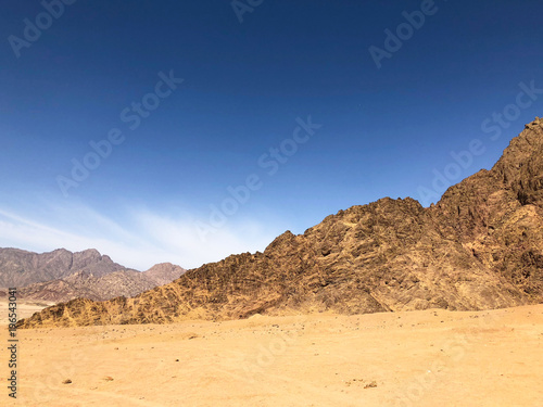 desert in with blue sky and mountains