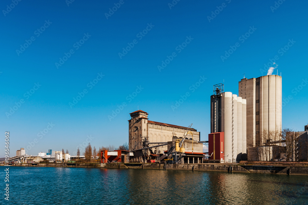 Naklejka premium Big mill plant in Strasbourg, old and new buildings
