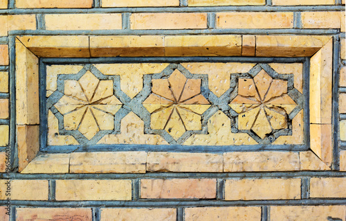      part of a large ornament of brickwork in the ancient Oriental style photo
